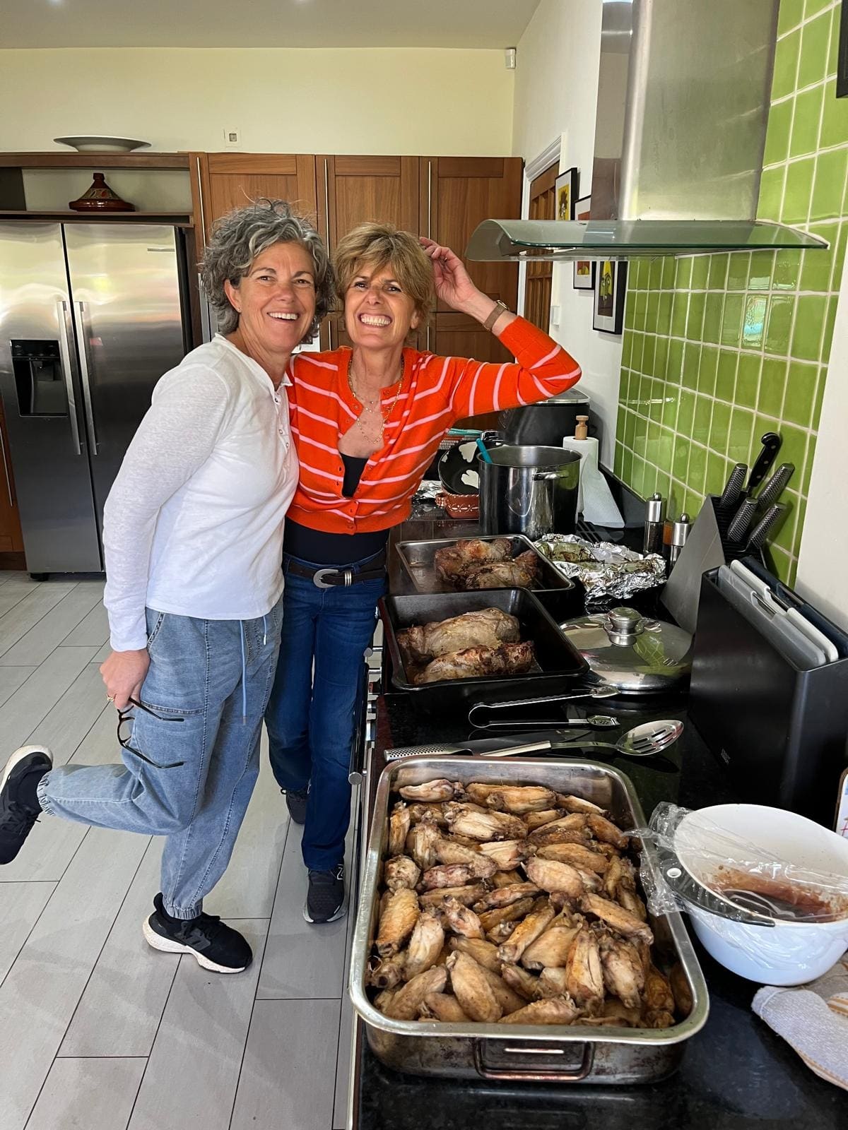 In the kitchen, with trays of cooked meat ready to go out