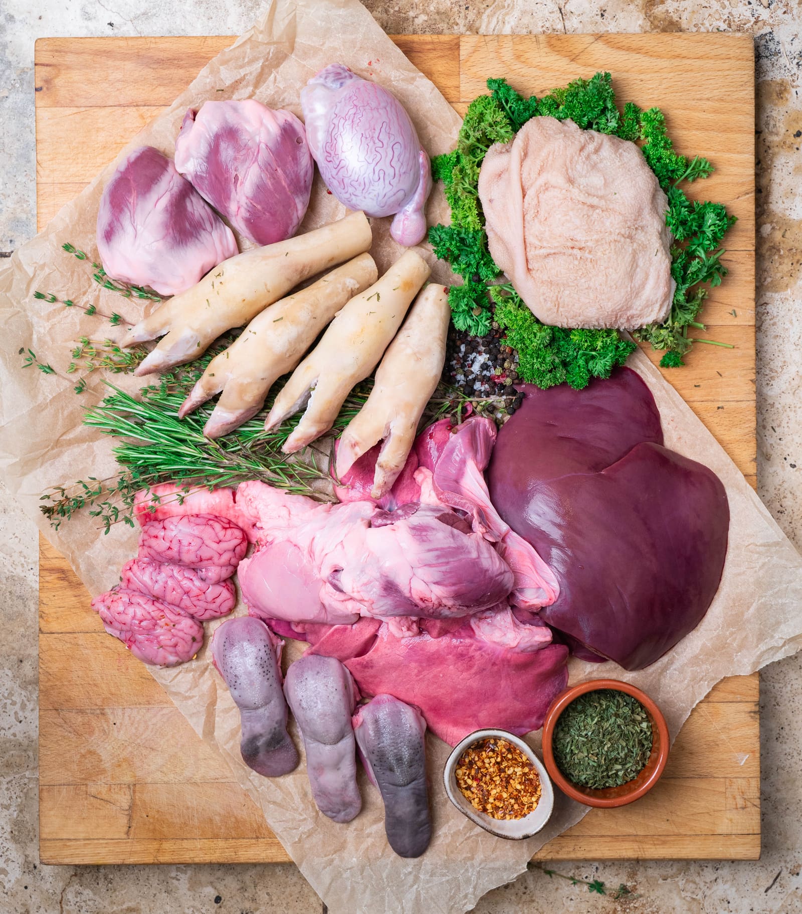 The offal range laid out: hearts, liver, tongues, trotters, brains and tripe