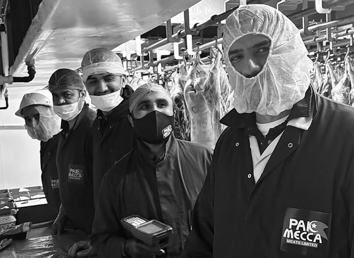 The Pak Mecca Meats team in company jackets and hairnets