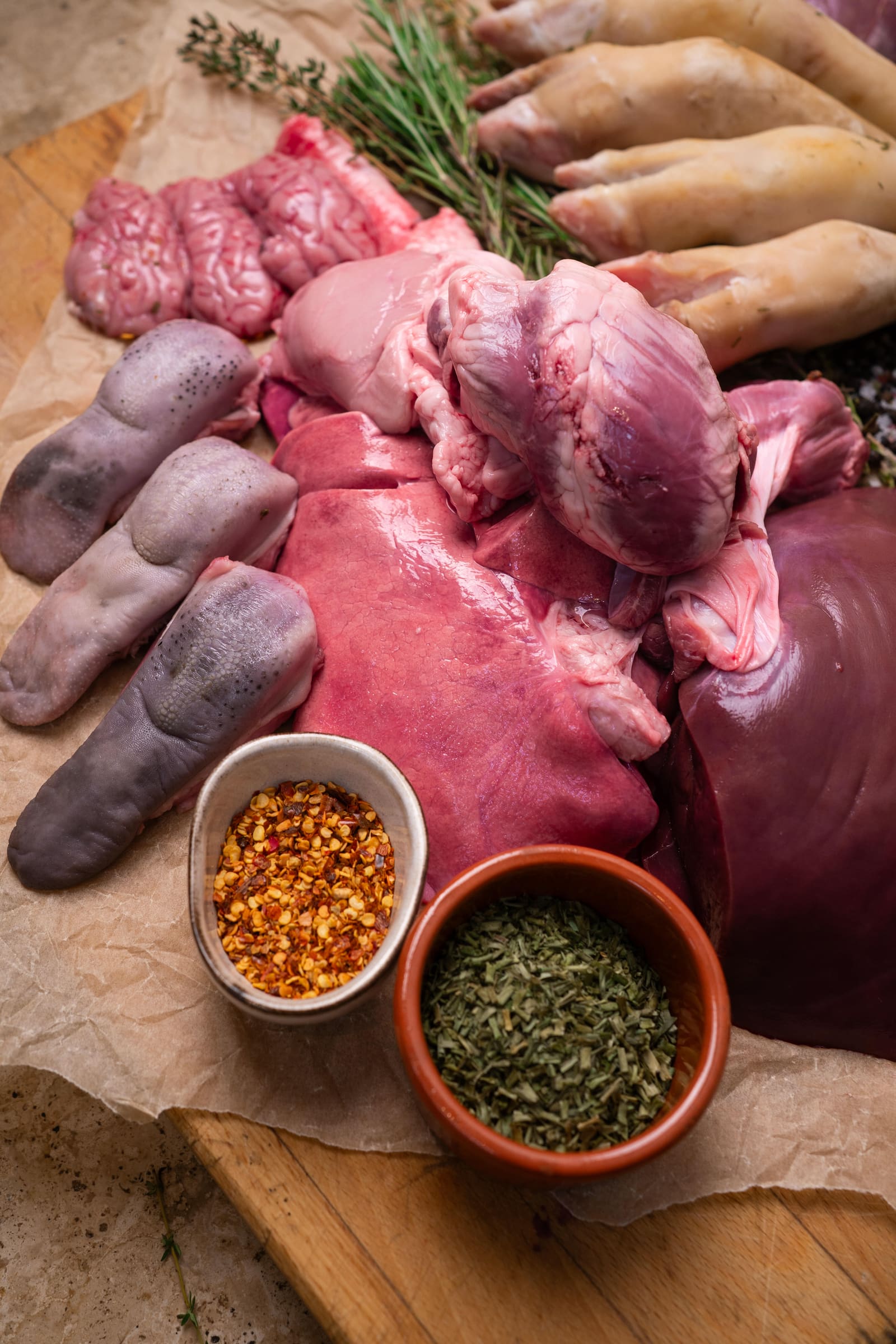 The offal range laid out: hearts, liver, tongues, trotters, brains and tripe