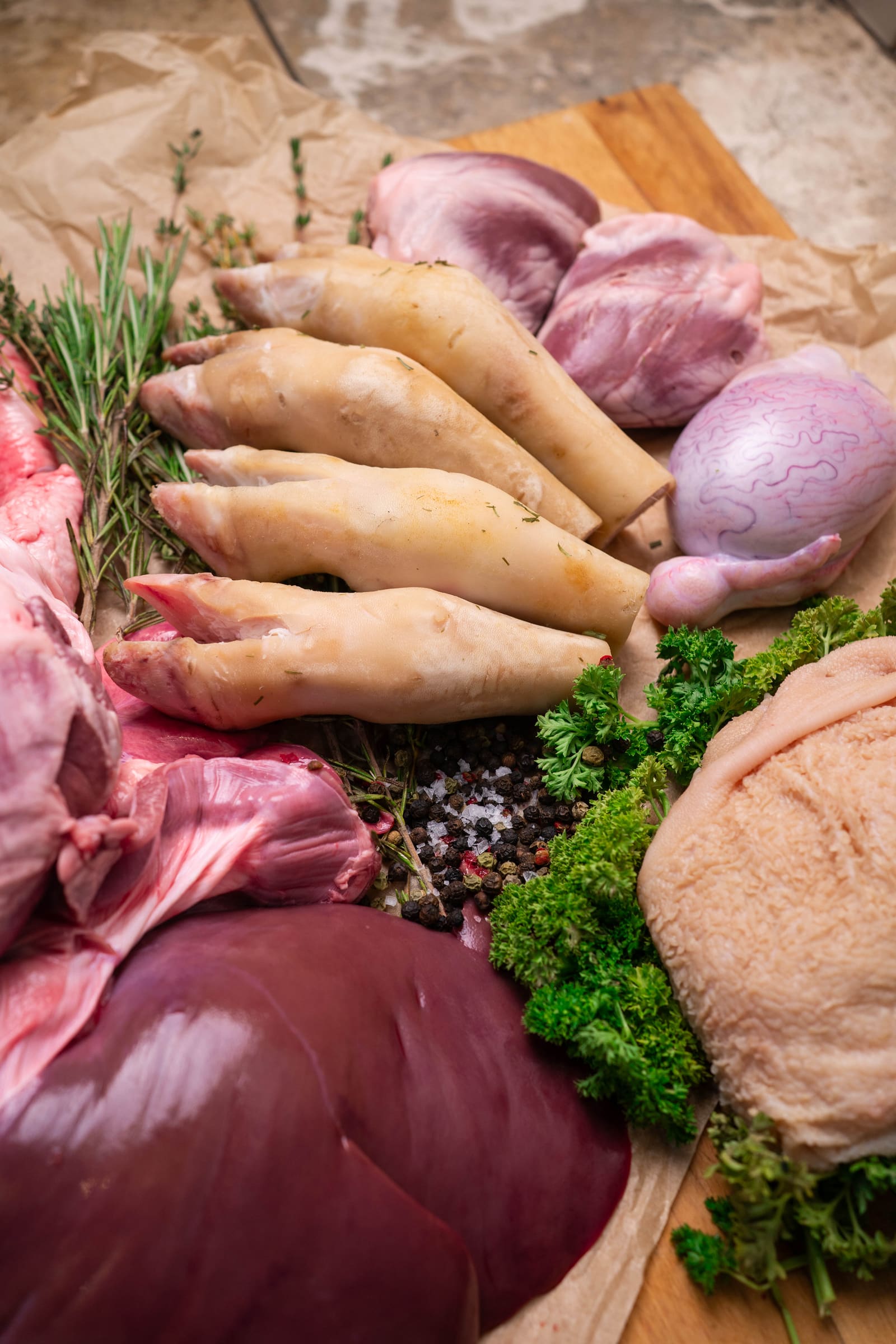 The offal range laid out: hearts, liver, tongues, trotters, brains and tripe