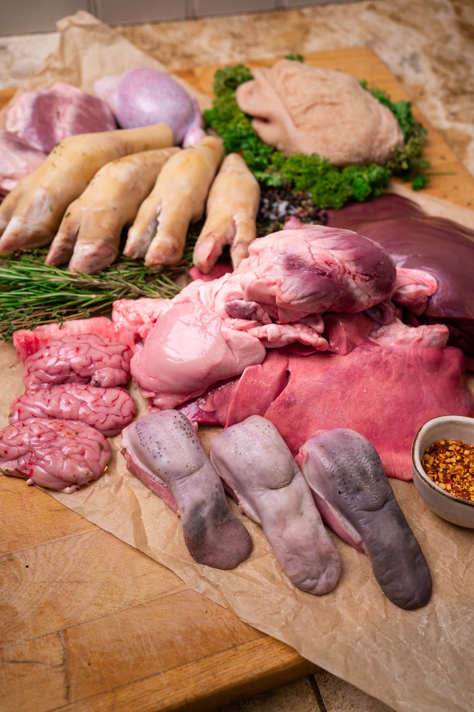 The offal range laid out: hearts, liver, tongues, trotters, brains and tripe